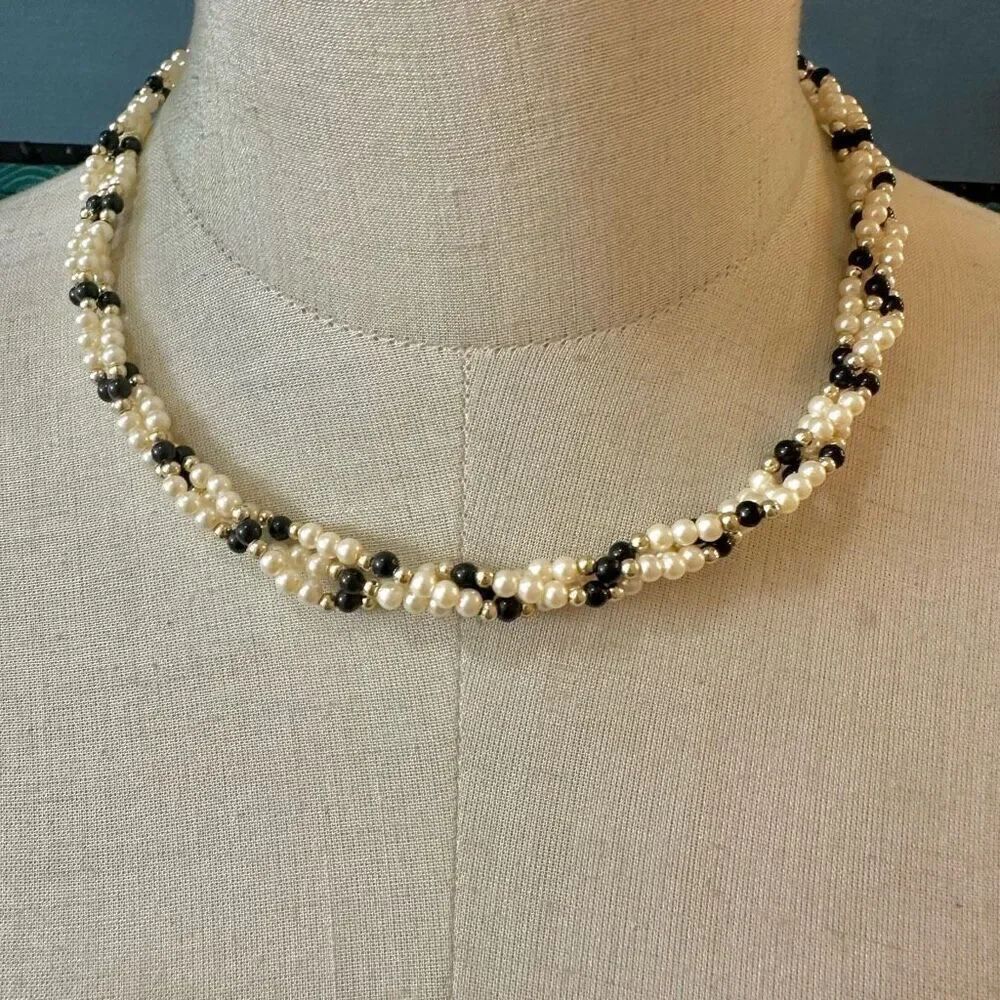 Faux pearl black and gold tone beaded twisted necklace